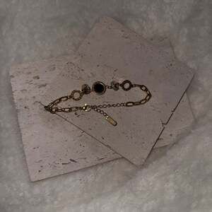 Gold overlay stainless steel bracelet with Roman numerals